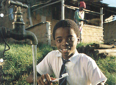 Kid brushing his teeth